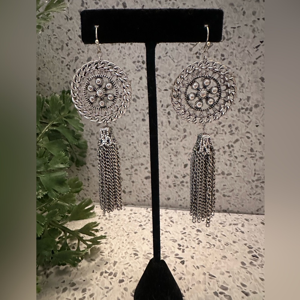 Silver tone medallion style dangle earrings